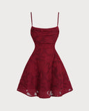 Woman wearing a wine red floral jacquard mini dress with a lace-up back