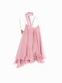 Woman wearing a pink tiered ruffle mini dress with a matching scarf