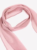 Woman wearing a pink tiered ruffle mini dress with a matching scarf
