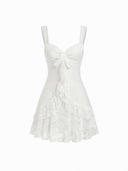 Woman wearing a floral lace mini dress with a sweetheart neckline