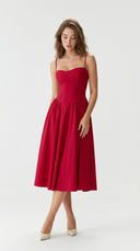 Woman wearing a red dress on a white background