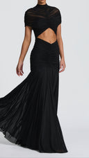 Woman wearing a black ruched cape maxi dress, front view