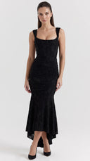 Woman wearing a black floral burnout fishtail midi dress