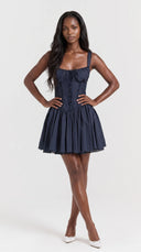 Woman wearing a French navy corset mini dress