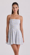 Woman wearing a periwinkle wildflower-print mini sundress