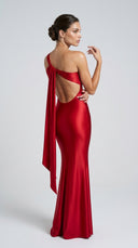Red evening gown with open back on a white background