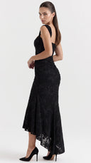 Woman wearing a black floral burnout fishtail midi dress