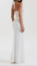 Woman wearing a white ruched maxi skirt, back view