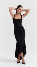 Woman wearing a black floral burnout fishtail midi dress