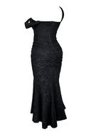 Woman wearing a black floral burnout fishtail midi dress