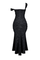 Woman wearing a black floral burnout fishtail midi dress