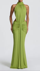 Anais olive green ruched mermaid maxi dress, side view with waist cut-out detail