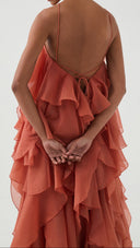 Isadora coral clay layered ruffle maxi dress, angled view of skirt movement