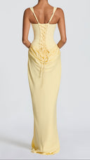 Odette lemon yellow pleated corset maxi dress, side view showing cowl overlay skirt